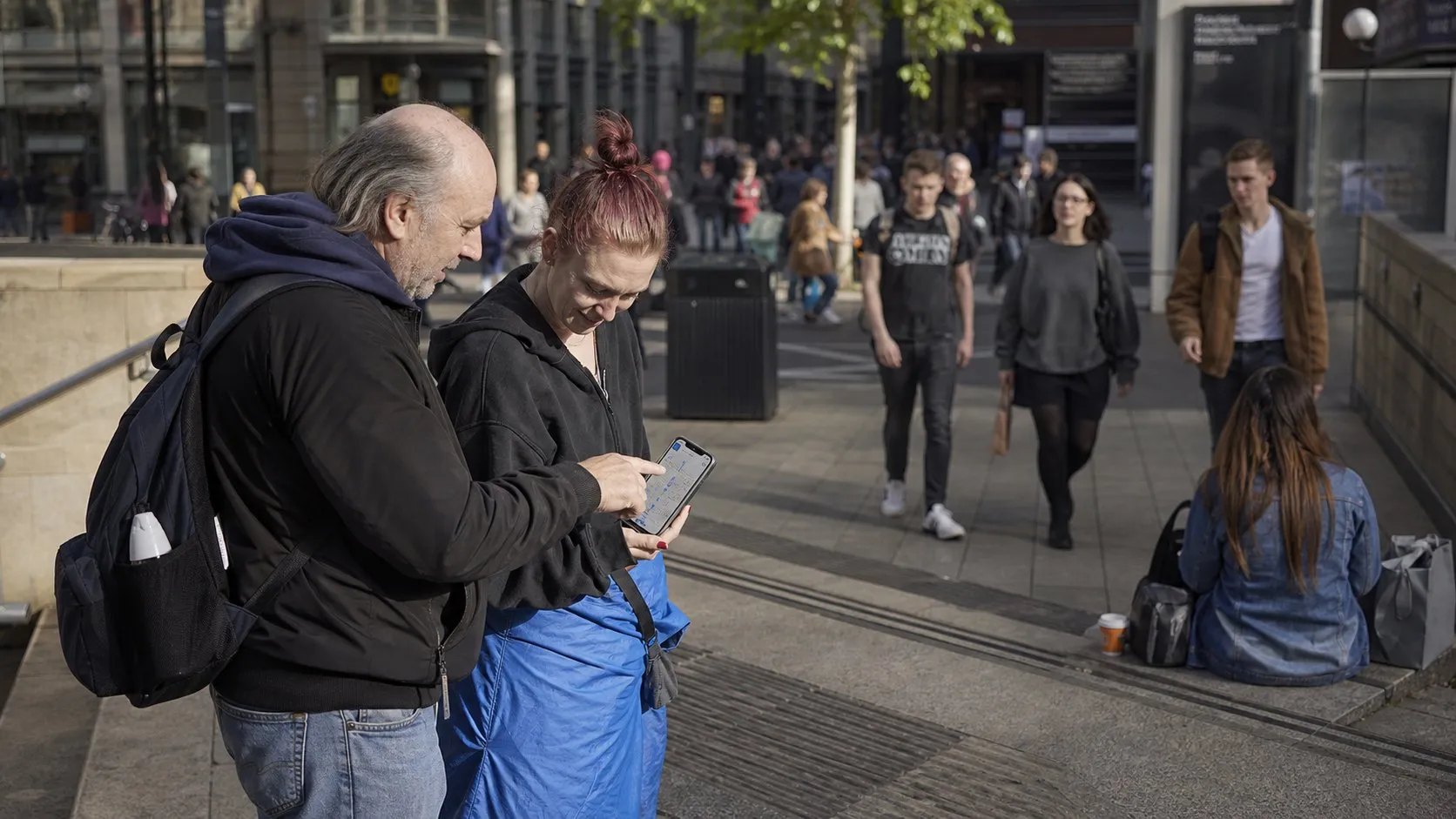 A real city moment showing Karpo helping someone act after using HeyGen