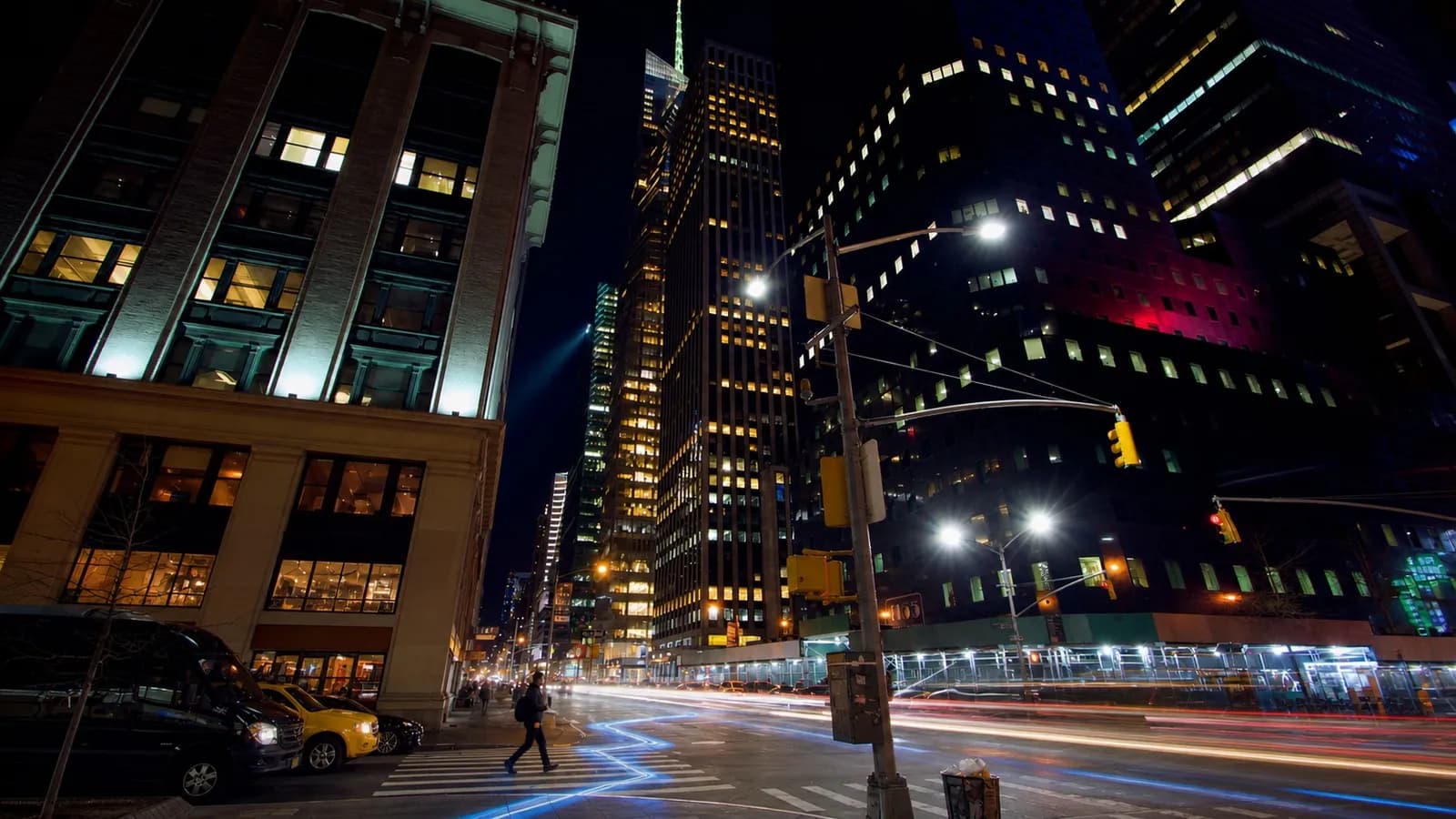 A real city intersection at night representing Apple Maps navigation and spatial context
