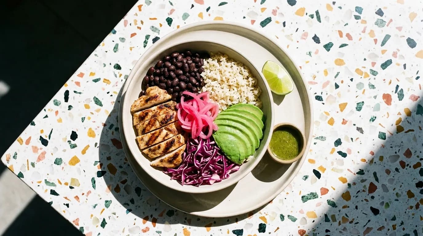 A grain and vegetable bowl on a bright table