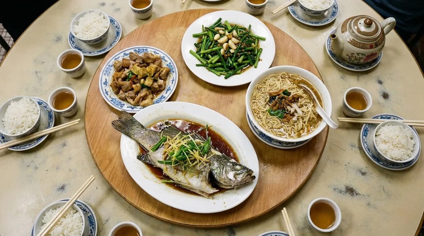 An overhead view of several shared dishes on a table