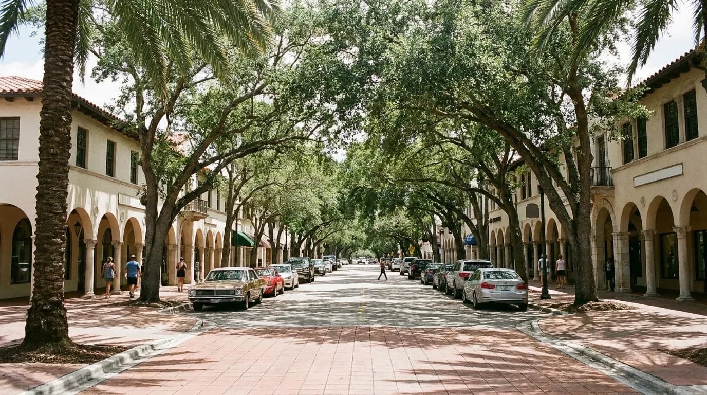 A tree-lined Coral Gables street with shopfronts