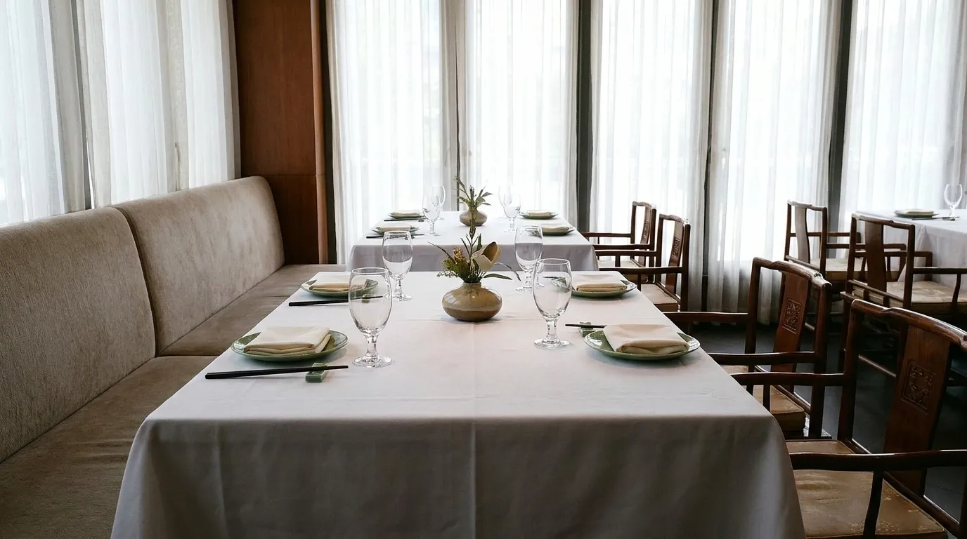 A restaurant table laid for four before a business lunch