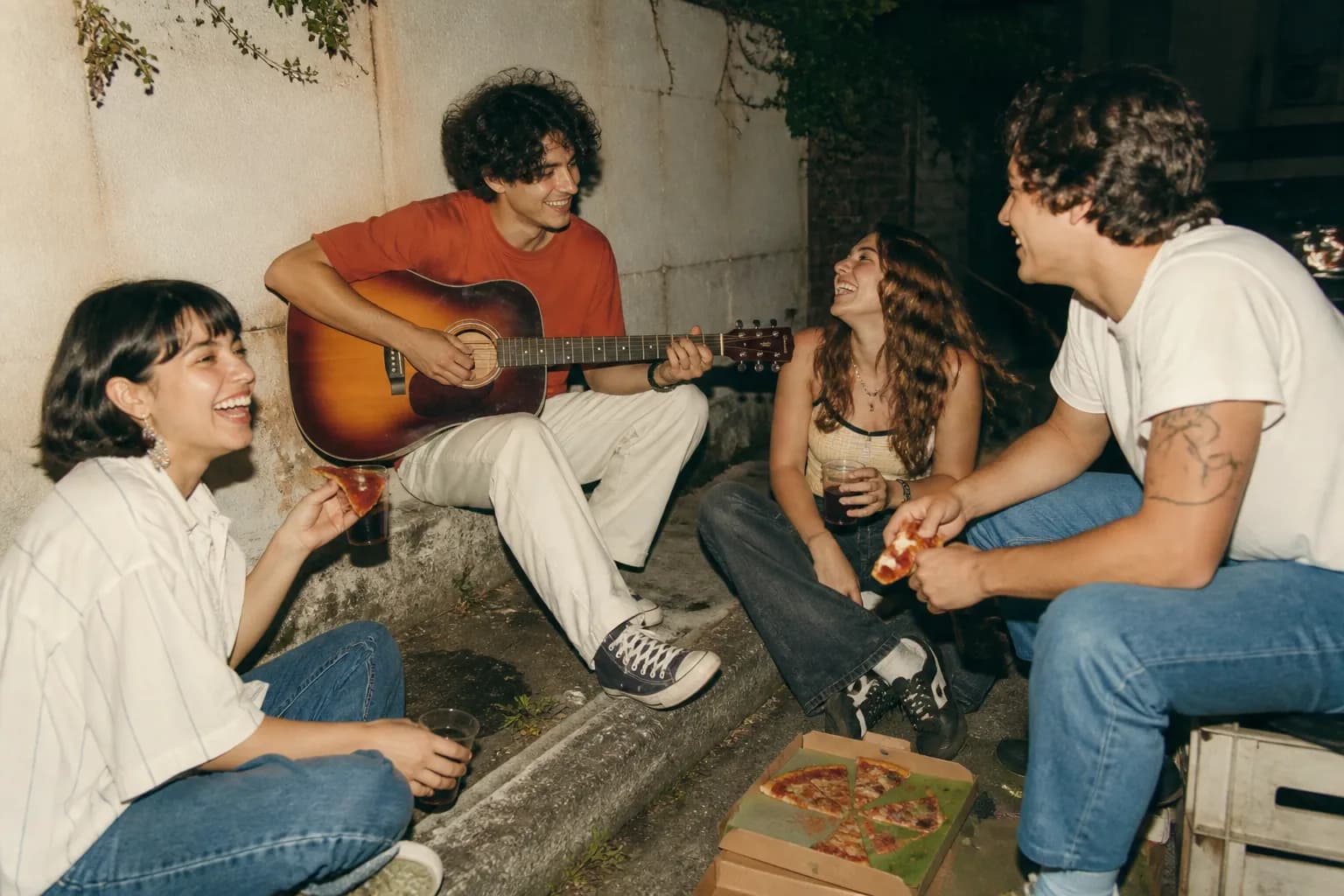 Friends enjoying a relaxed, low-cost outdoor hangout together