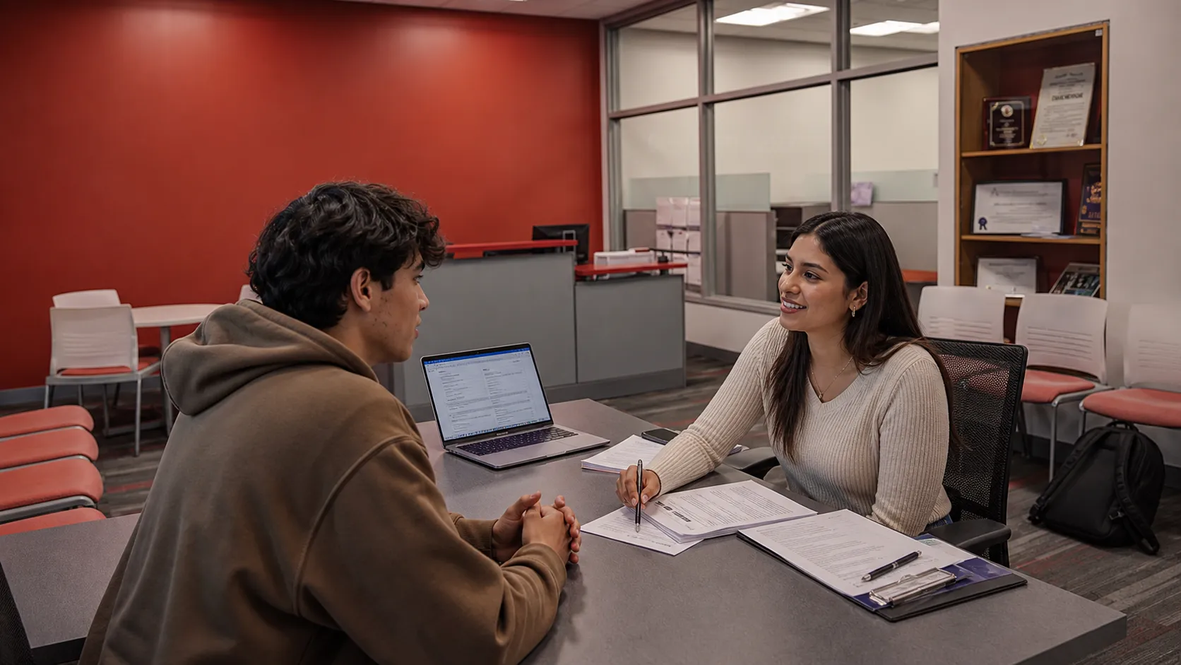 A student meeting with a counselor in a New York college financial services office