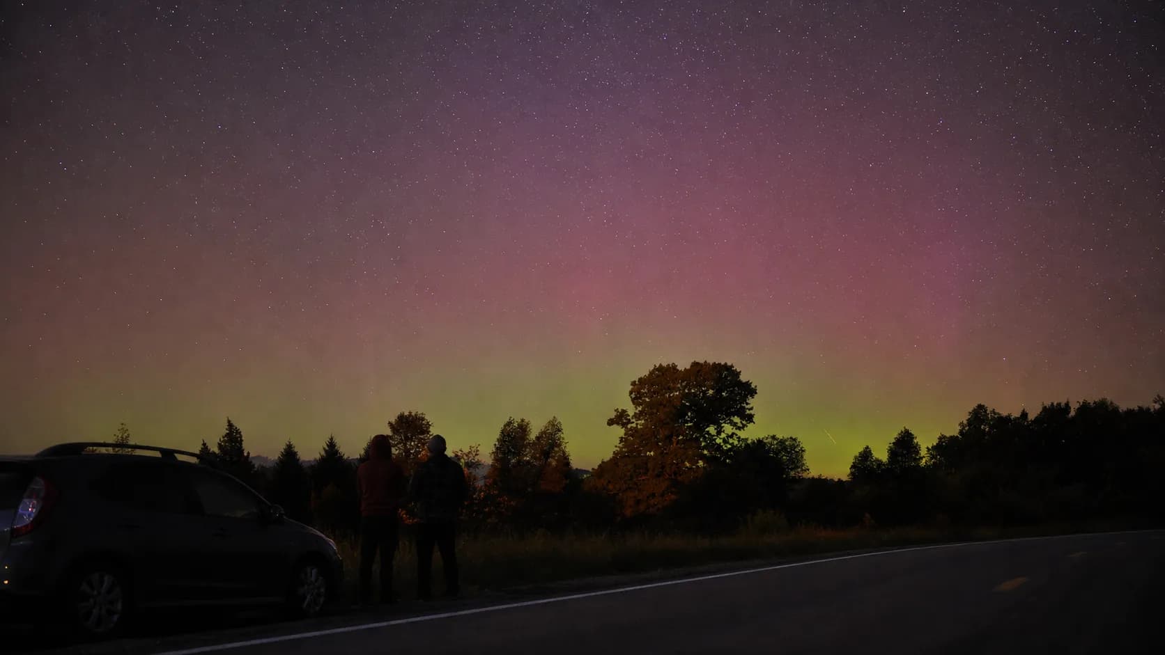 Restrained aurora above a safe roadside viewing stop in New York State