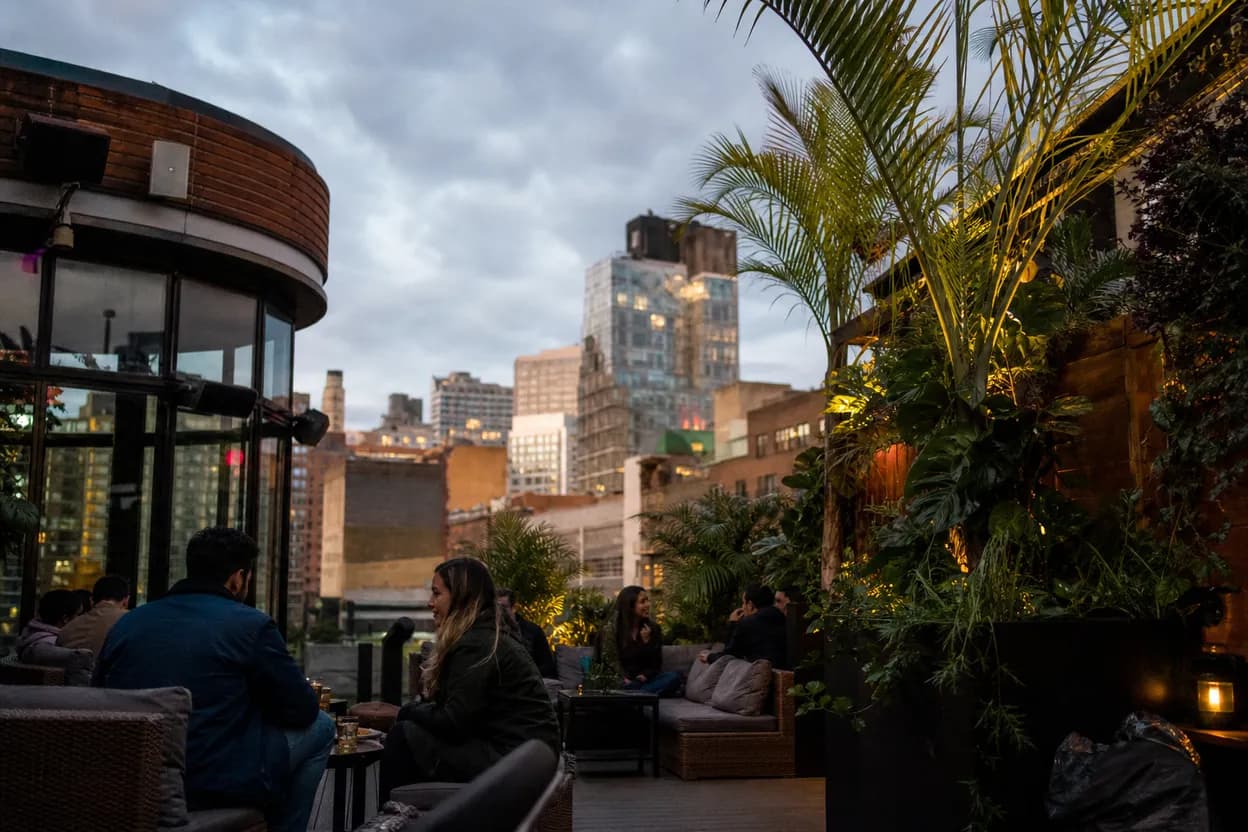 Cover scene for The DL Retractable Rooftop for a Rain-Threat Birthday Night Downtown