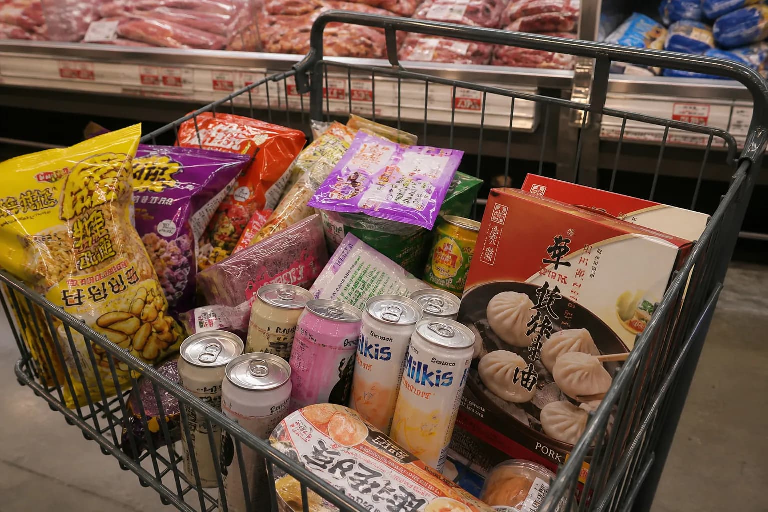 A shopping cart filled with Asian snacks and frozen dumplings at the Westwood 99 Ranch.
