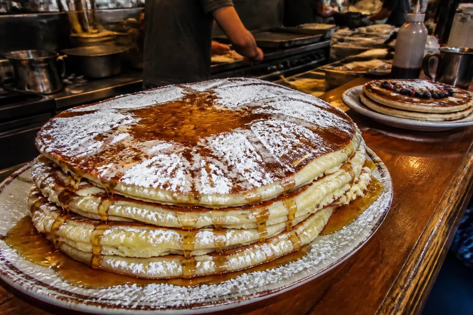 A towering plate of sweet pancakes on the counter at The Griddle Cafe in West Hollywood.