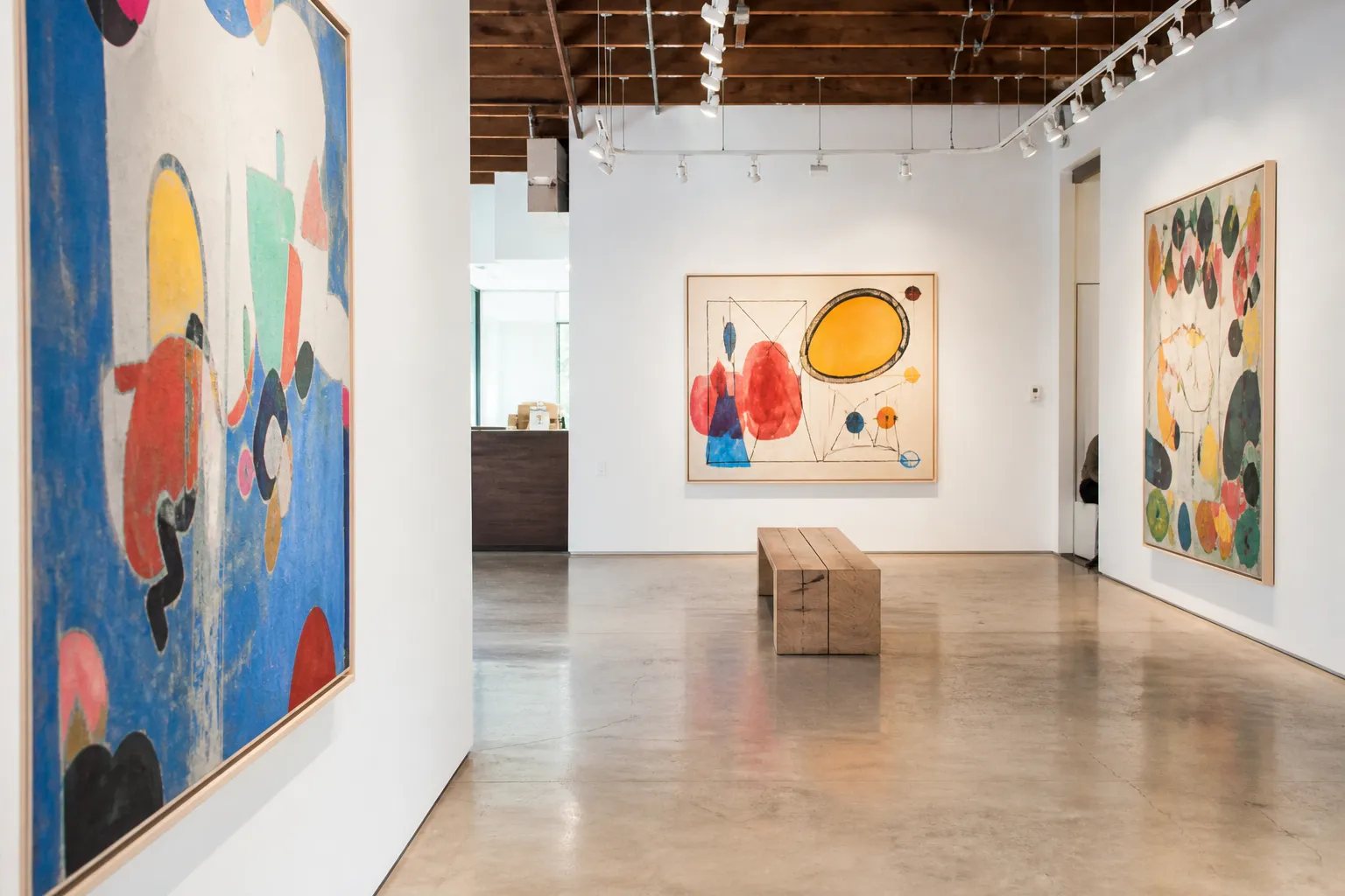 A minimalist white-wall art gallery in Culver City with concrete floors.