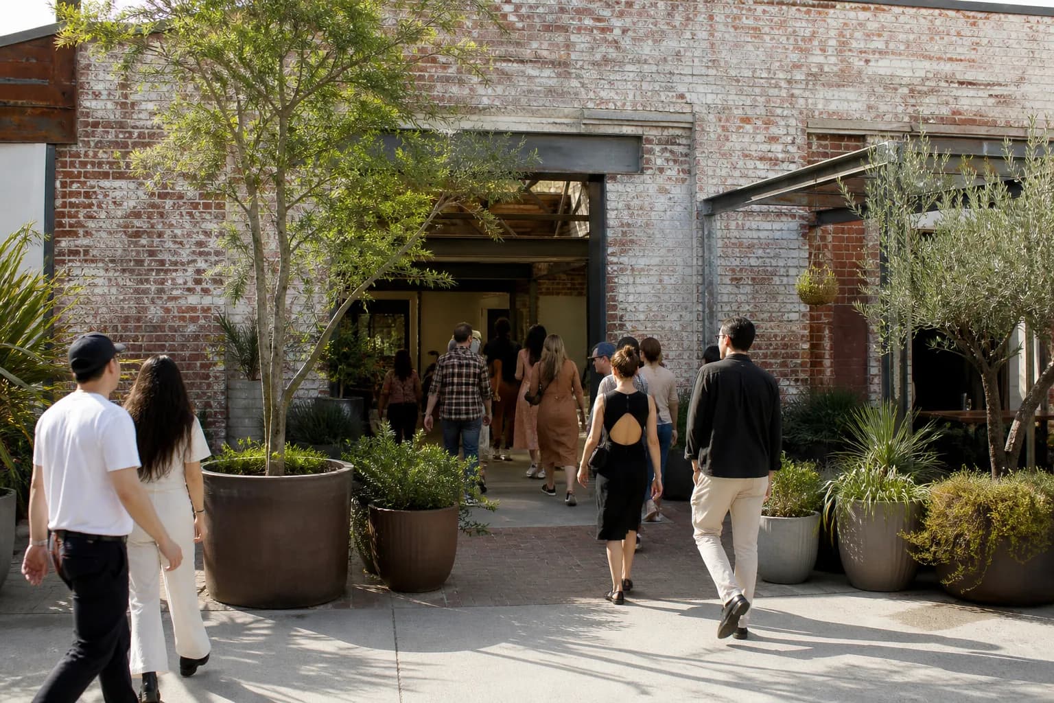 The rustic brick courtyard entrance of Manuela restaurant in the Los Angeles Arts District.