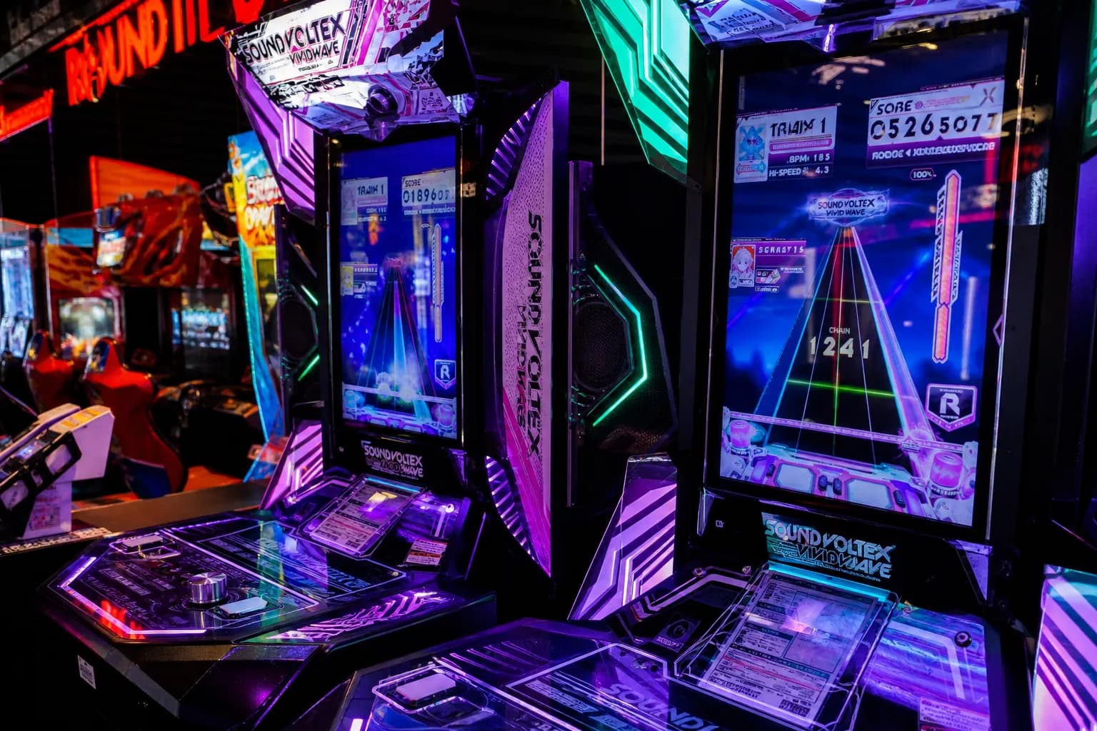 Glowing Japanese rhythm arcade machines at Round 1 in Burbank, California.