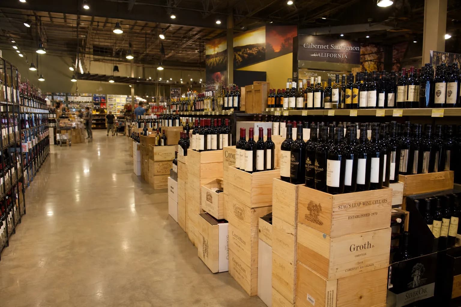 The bright interior checkout counter and towering wine shelving at a Los Angeles retail beverage warehouse.