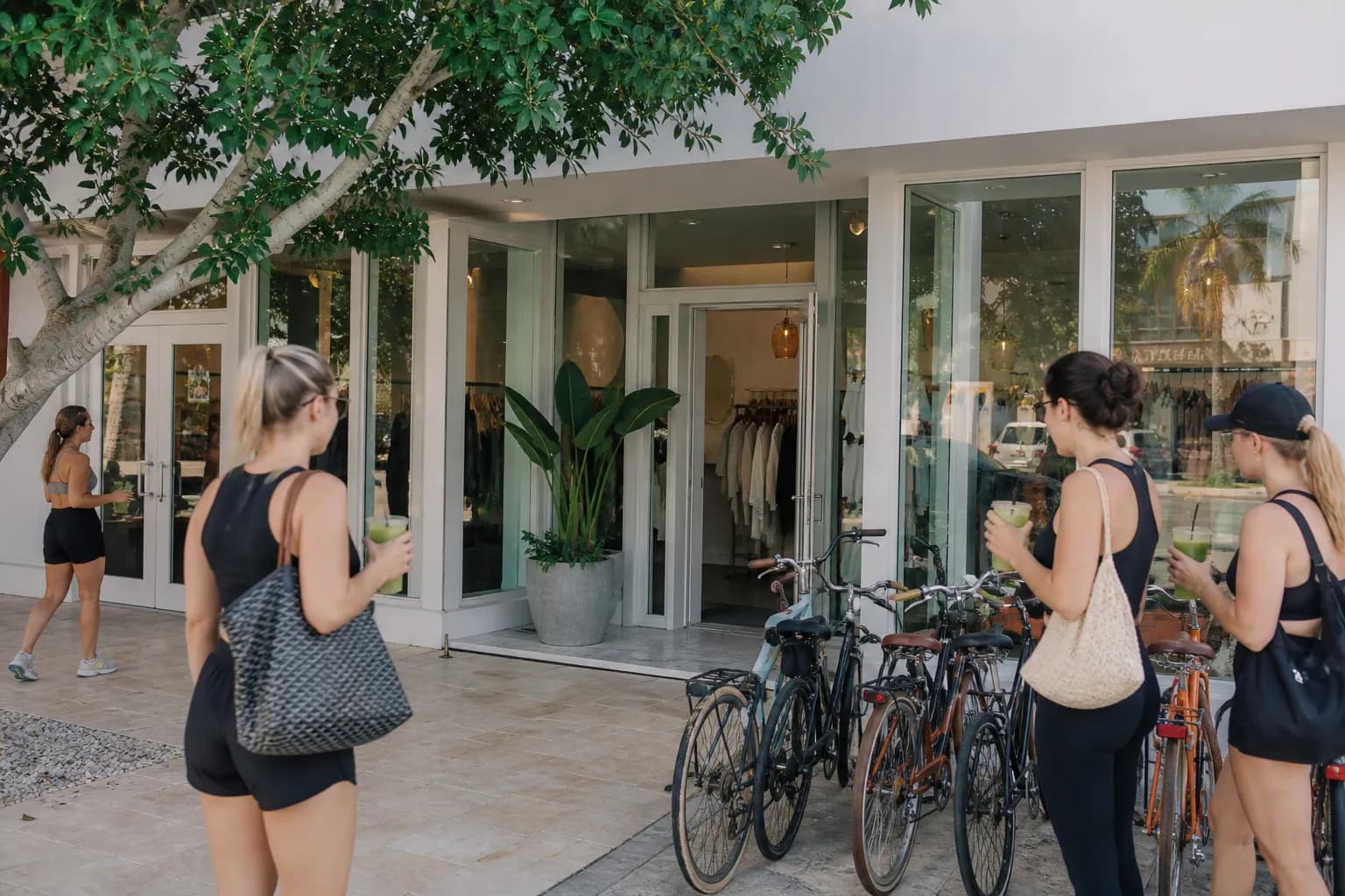 A modern storefront in Miami's Sunset Harbour neighborhood with people sitting outside enjoying smoothies