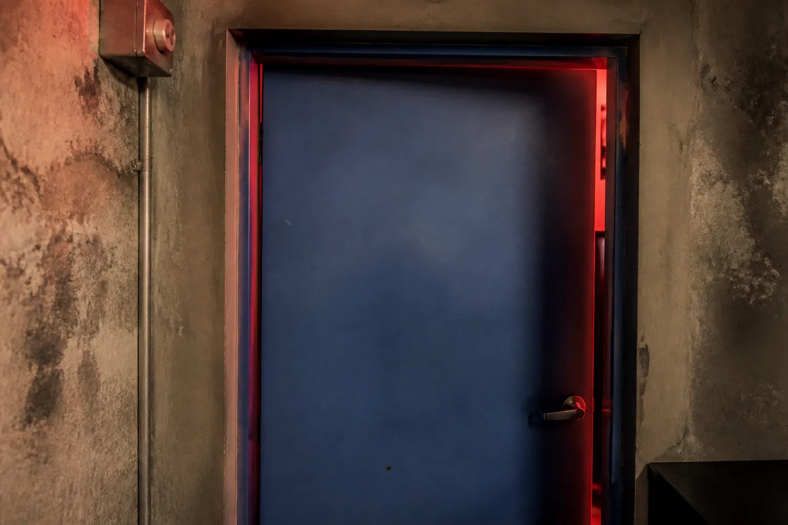The secret blue door entrance leading to the Coyo Taco speakeasy club in Wynwood