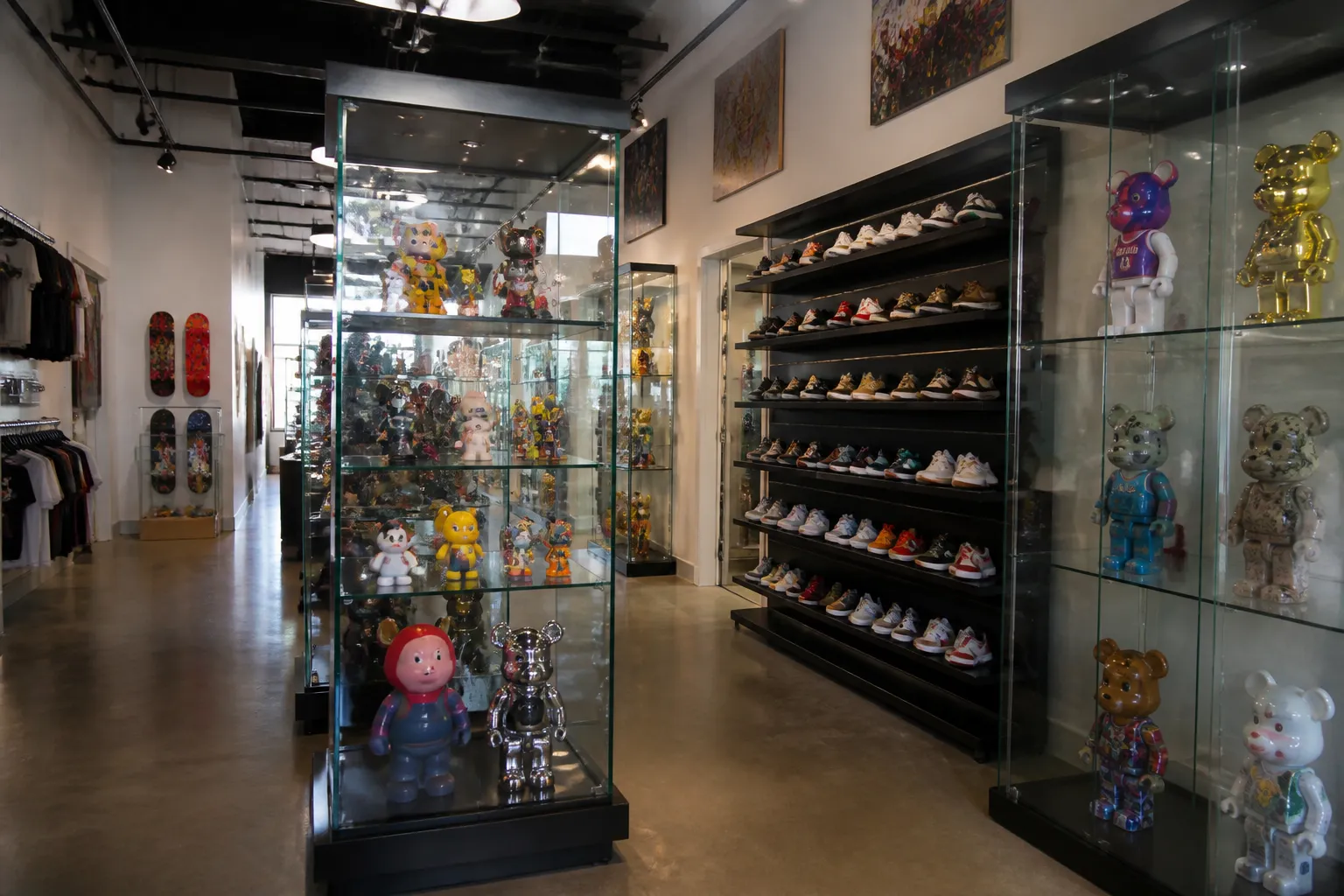 Glass cases inside a Wynwood boutique displaying designer collectible toys.