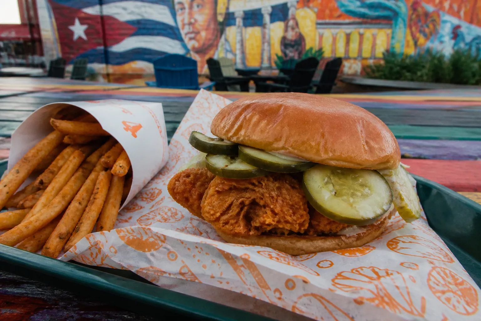 Close-up of a spicy chicken sandwich on a table in Little Havana