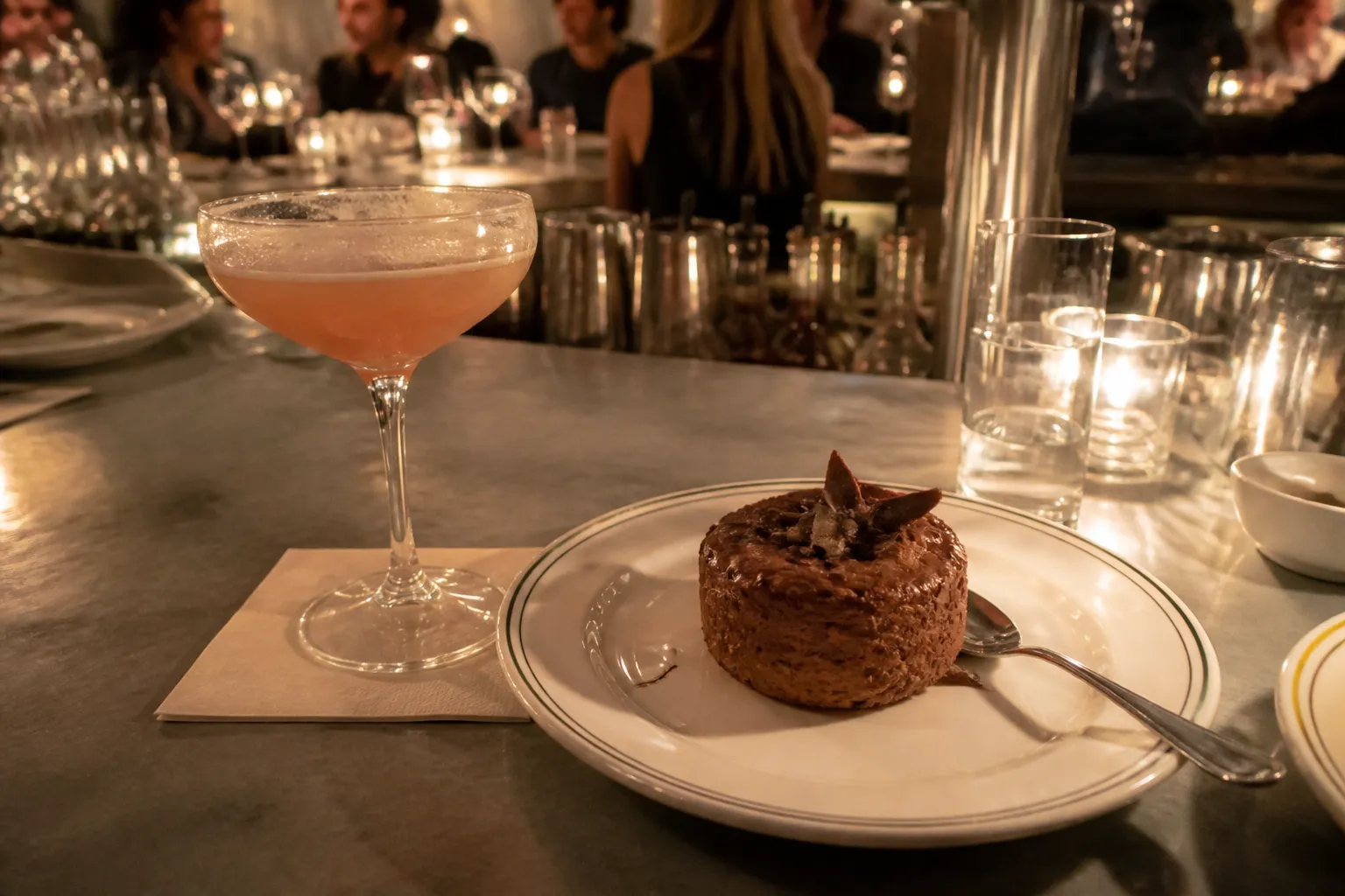 A chocolate mousse dessert and cocktail served on the zinc bar at LPM Miami.