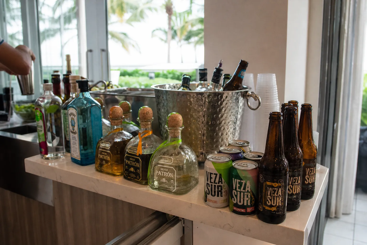 A party bar setup in Miami Beach featuring craft beer and premium tequila.