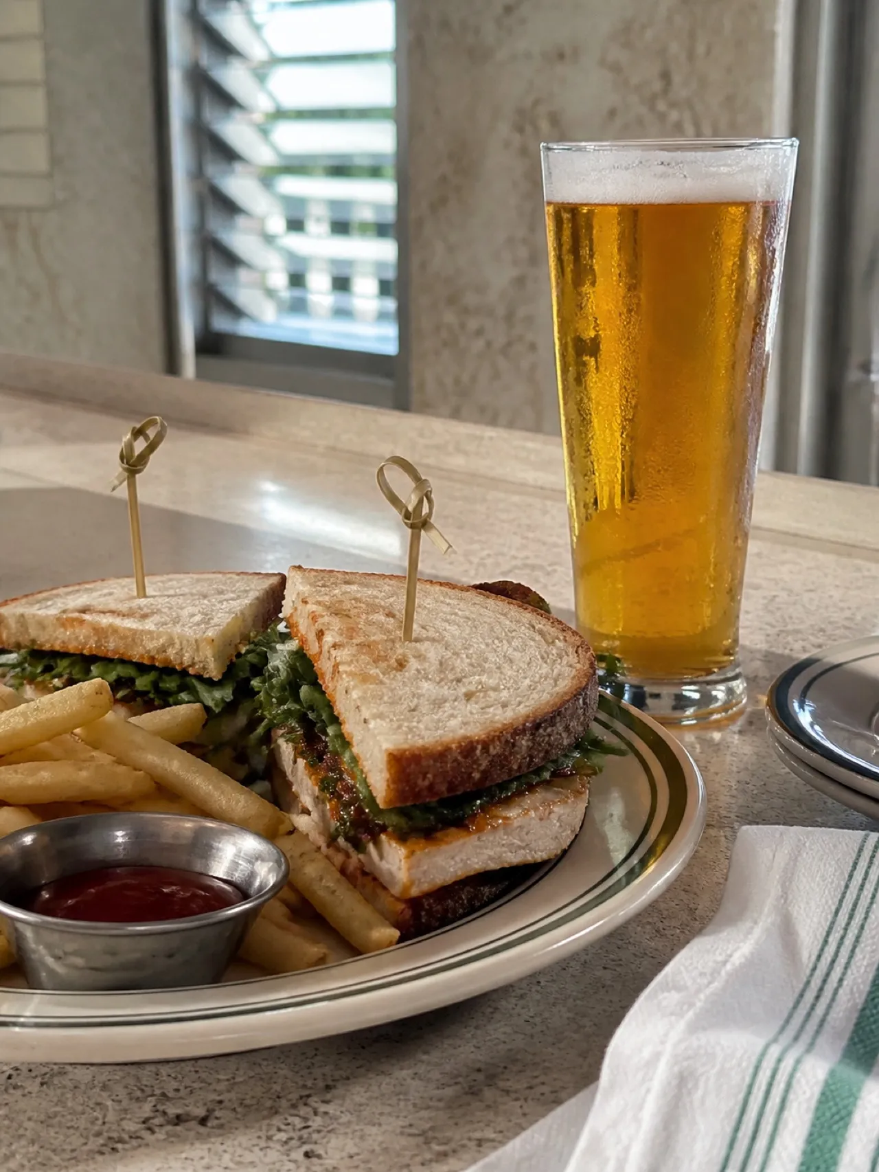 Beer glass and a plate on a bar table before kickoff