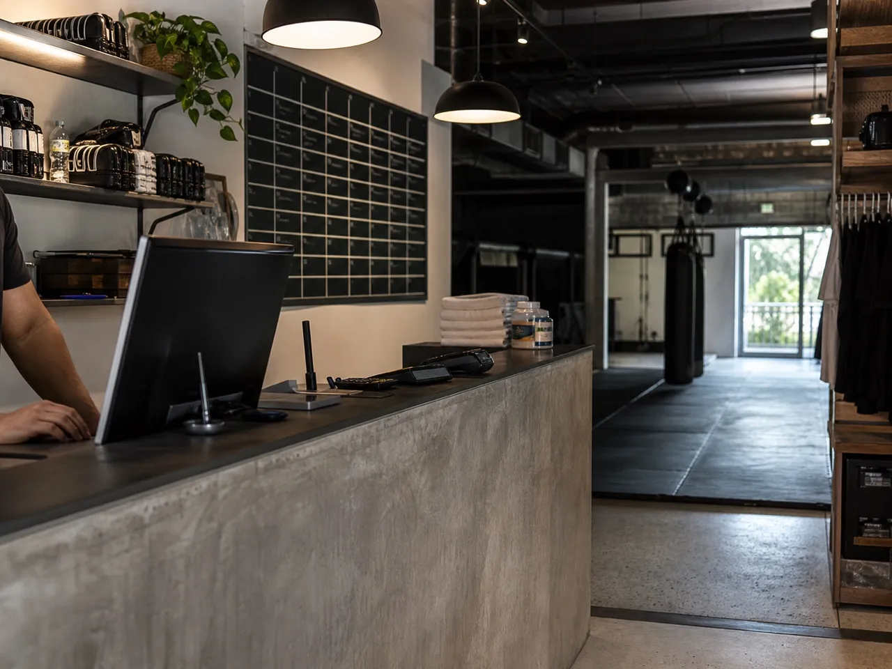 Gym reception counter with a mat floor beyond