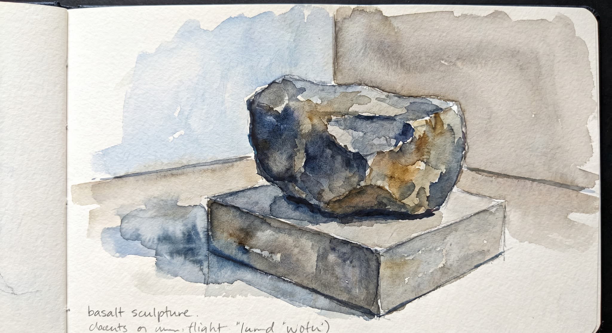AI-generated watercolor: close-up of a single Noguchi-style stone sculpture in a Long Island City gallery — a smooth basalt or granite abstract form roughly 4 feet tall on a low concrete plinth, partial polish-and-rough surface contrast, soft cool daylight from the upper left casting a subtle shadow, gallery wall behind painted a soft warm grey, a wooden floor visible at the base