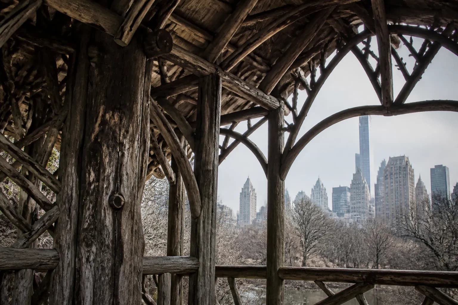 Rustic wooden structure of Cop Cot looking out toward Manhattan skyscrapers.