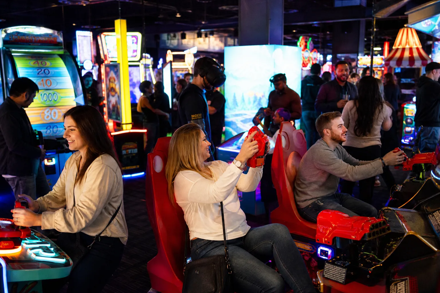 The energetic arcade floor with neon lights and VR games at the Midtown Manhattan Dave and Buster's.
