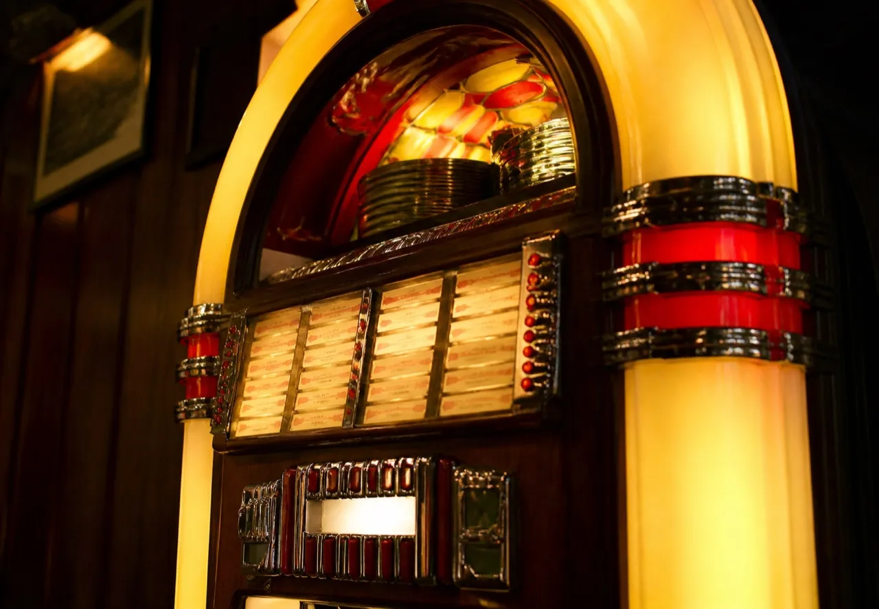 Jukebox selection panel with rows of printed title cards