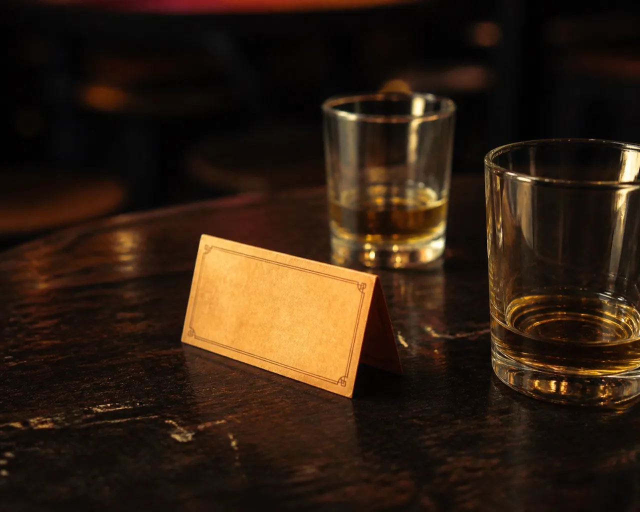 Reserved card and drinks on a high-top table