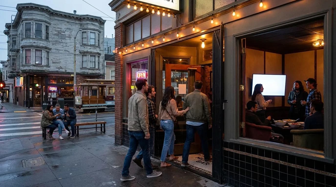 Group of friends gathered around large screen in San Francisco bar for Hulu streaming watch party