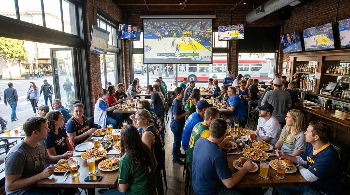 Sports bar interior with large screens showing WNBA game in San Francisco