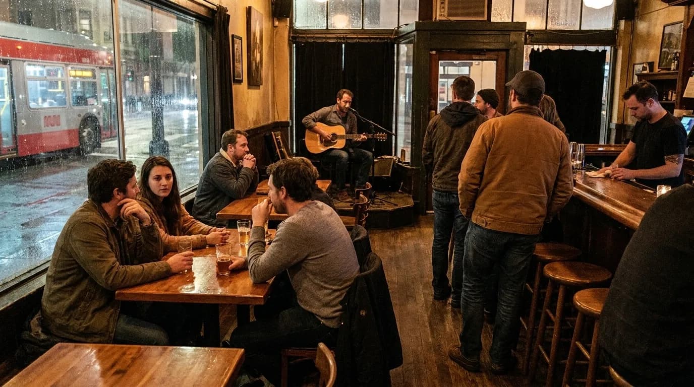 Audience listening attentively to acoustic guitar performance in intimate San Francisco venue