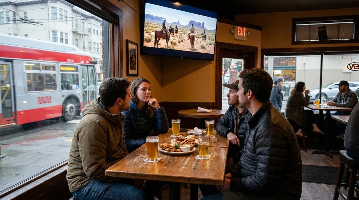 Shared bar snacks and drinks on a table in a casual San Francisco neighborhood pub