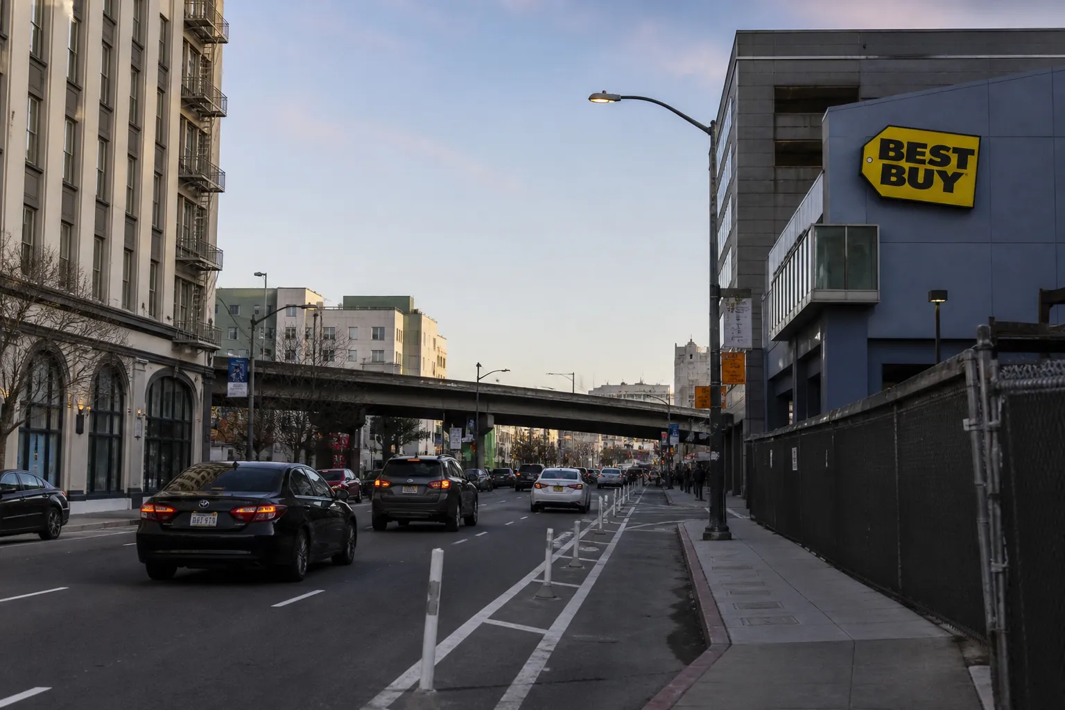 Street view of Harrison Street in SoMa near the Best Buy store and freeway overpass.