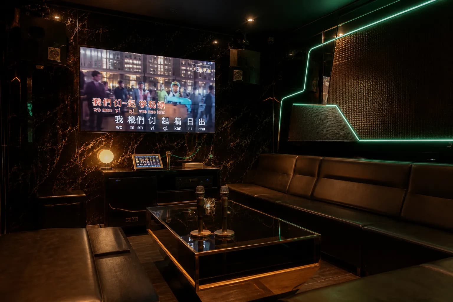 Sleek private karaoke room with leather seating, neon lights, and microphones.