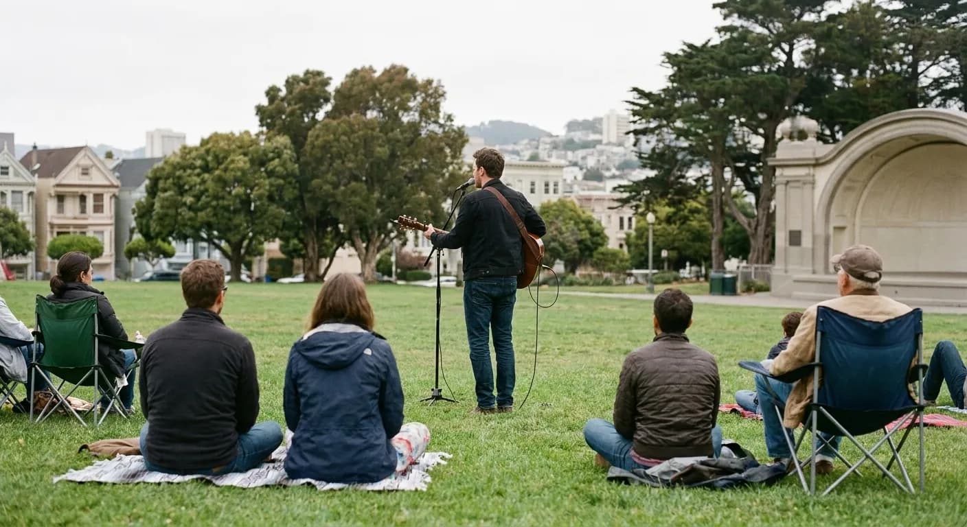 An afternoon performance on the grass in a San Francisco park with a small seated audience