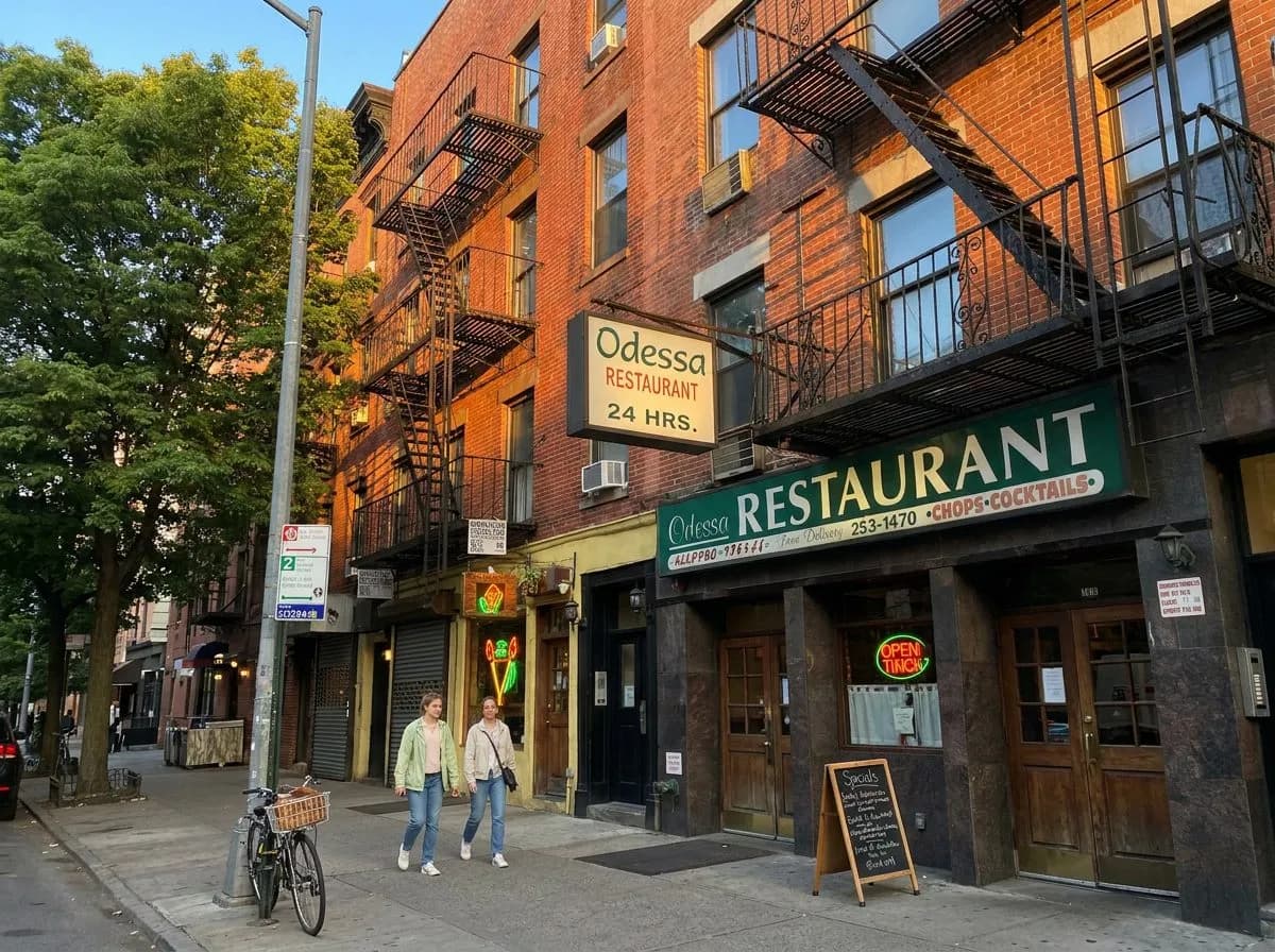 East Village storefront with neon tiki torch sign at evening (img2img re-imagining of a real CC BY-SA 4.0 photo by Kidfly182)