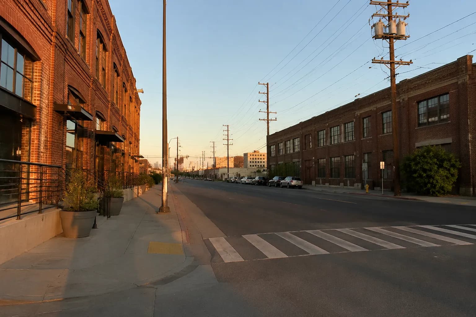 Alameda Street in the Arts District, Los Angeles, in late afternoon light with industrial buildings