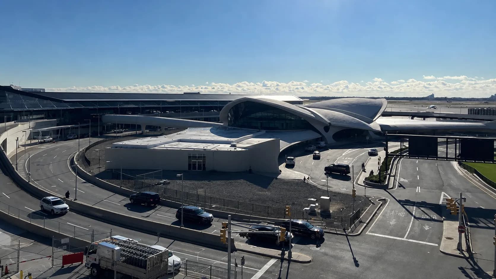 The curved exterior of the TWA Flight Center at JFK Airport in morning light.