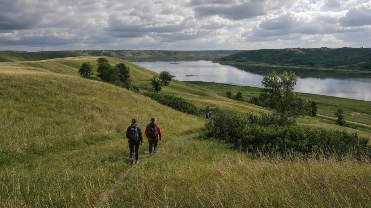 Hikers moving through an open landscape, representing AllTrails route discovery