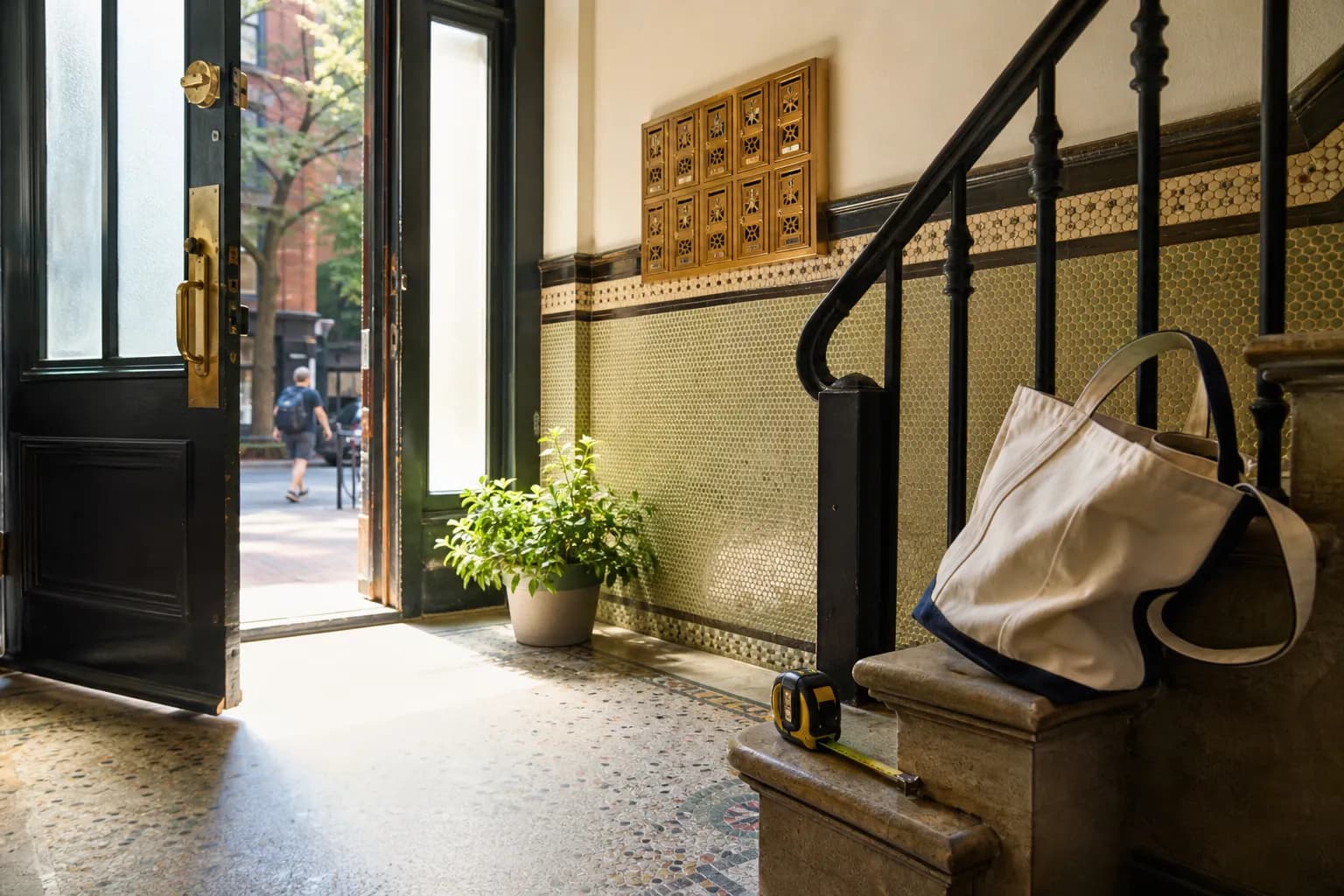 NYU neighborhood walk-up lobby with warm hallway light