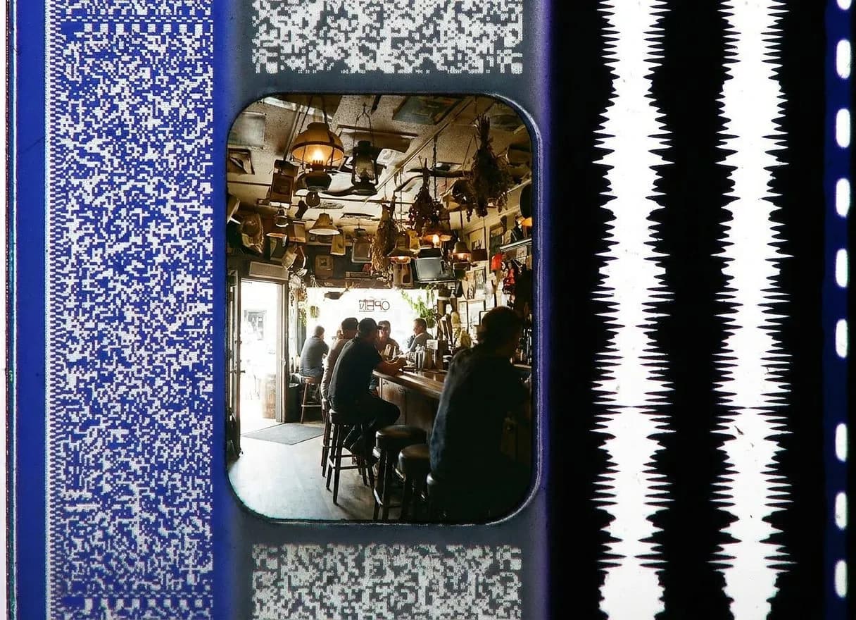 Bar stools at Specs' Twelve Adler Museum Café where the ceiling holds a century of sailor junk