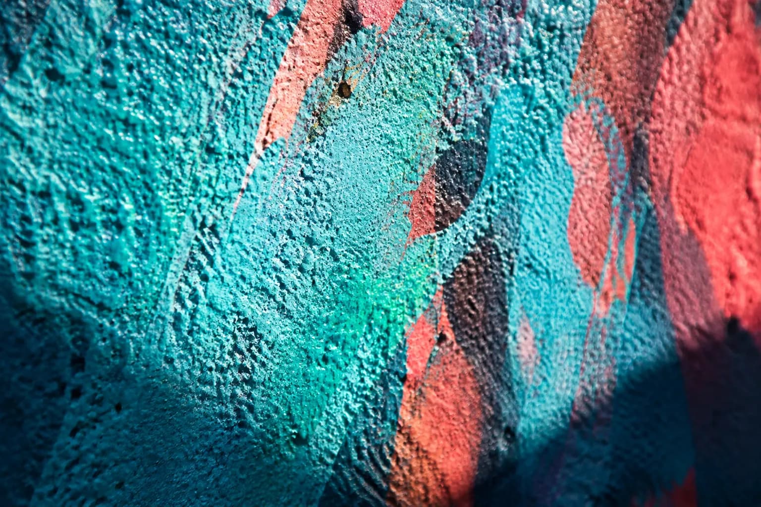 Close-up of textured spray paint layers on a Wynwood Walls mural in Miami