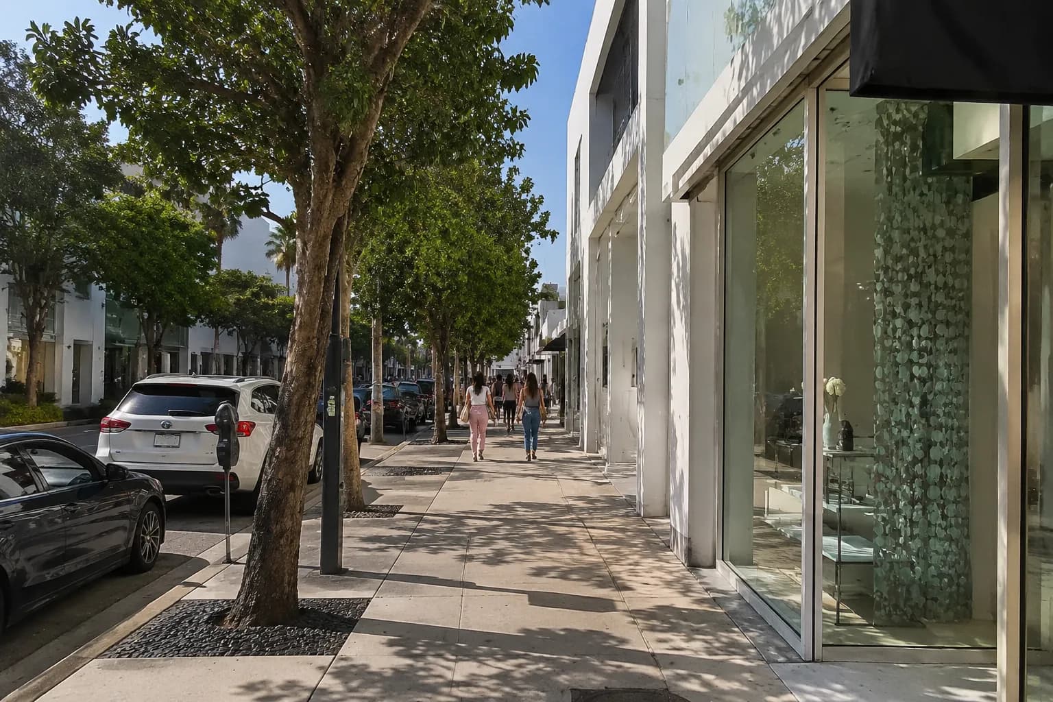 NE 40th Street in Miami Design District showing wide sidewalks, contemporary galleries, and metered parking on a sunny afternoon