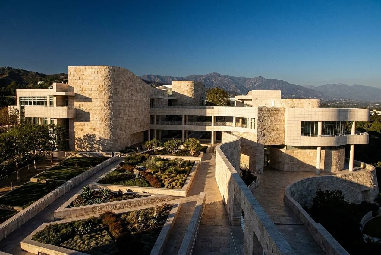 Travertine museum pavilions on a Los Angeles hilltop campus with geometric gardens and mountain views