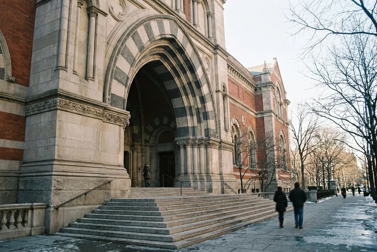 Classical museum entrance with wide stone steps on Fifth Avenue in winter morning light