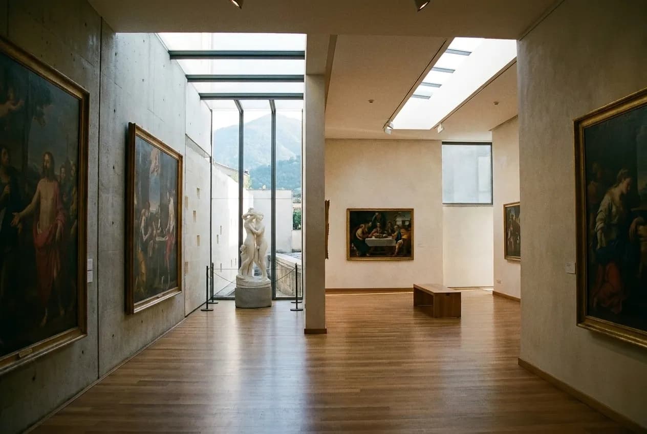 Museum gallery interior with natural skylight illumination and paintings on white walls