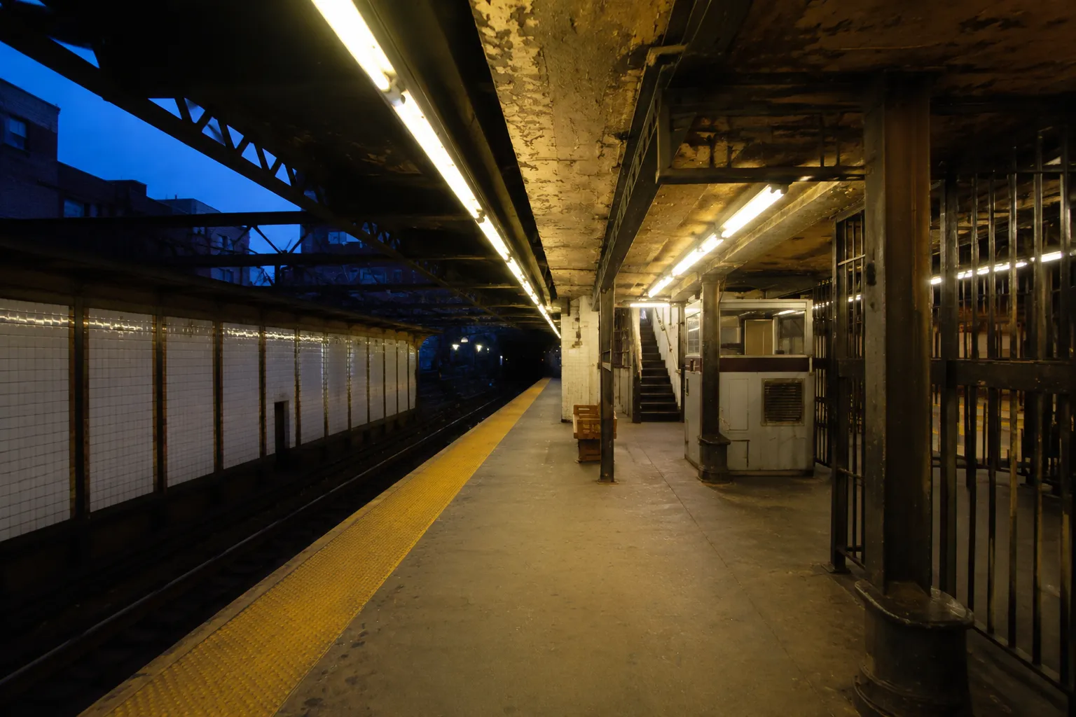 First Avenue subway platform with yellow safety line and tunnel entrance visible