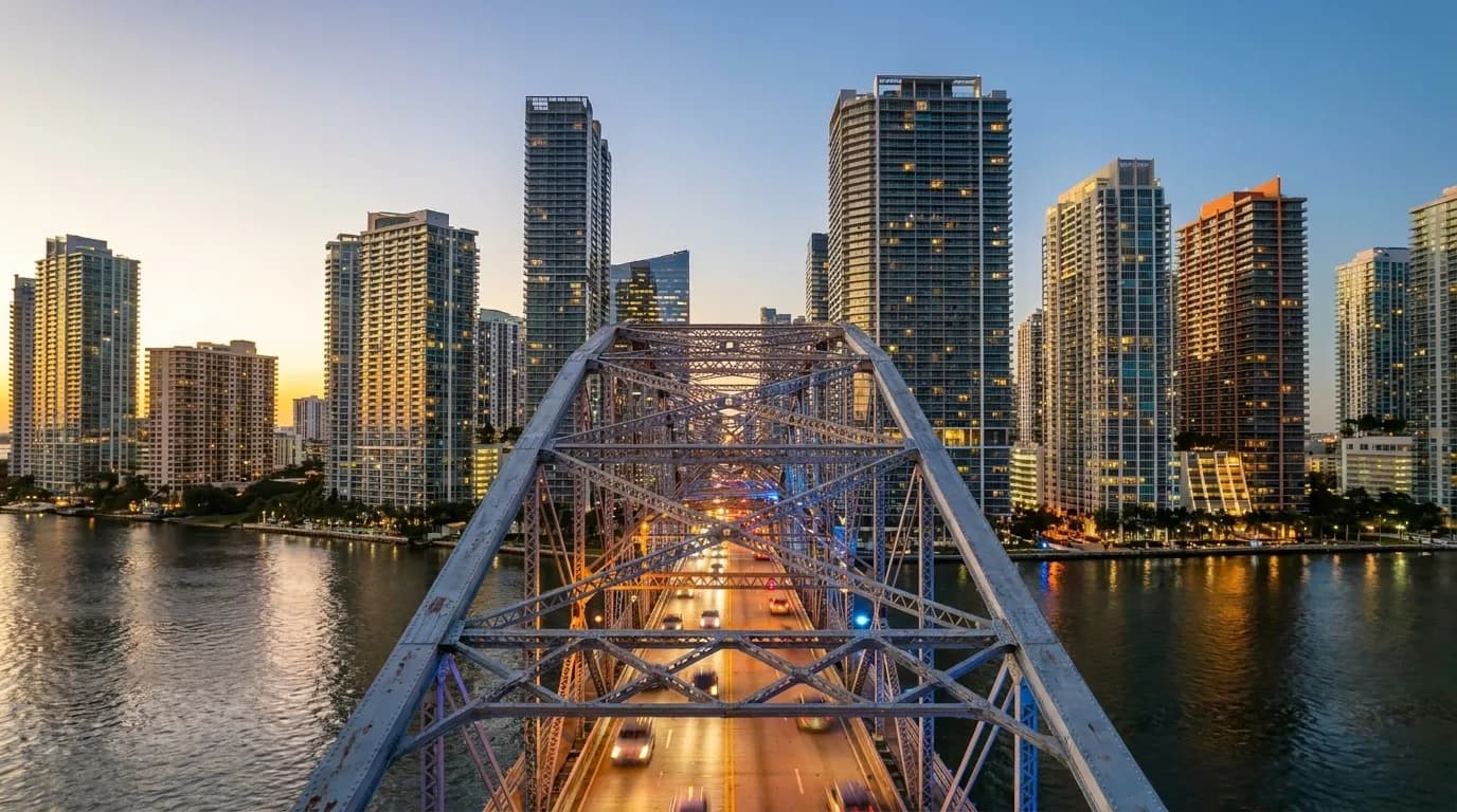 Brickell Avenue skyline at dusk with high-rise towers and traffic below in Miami