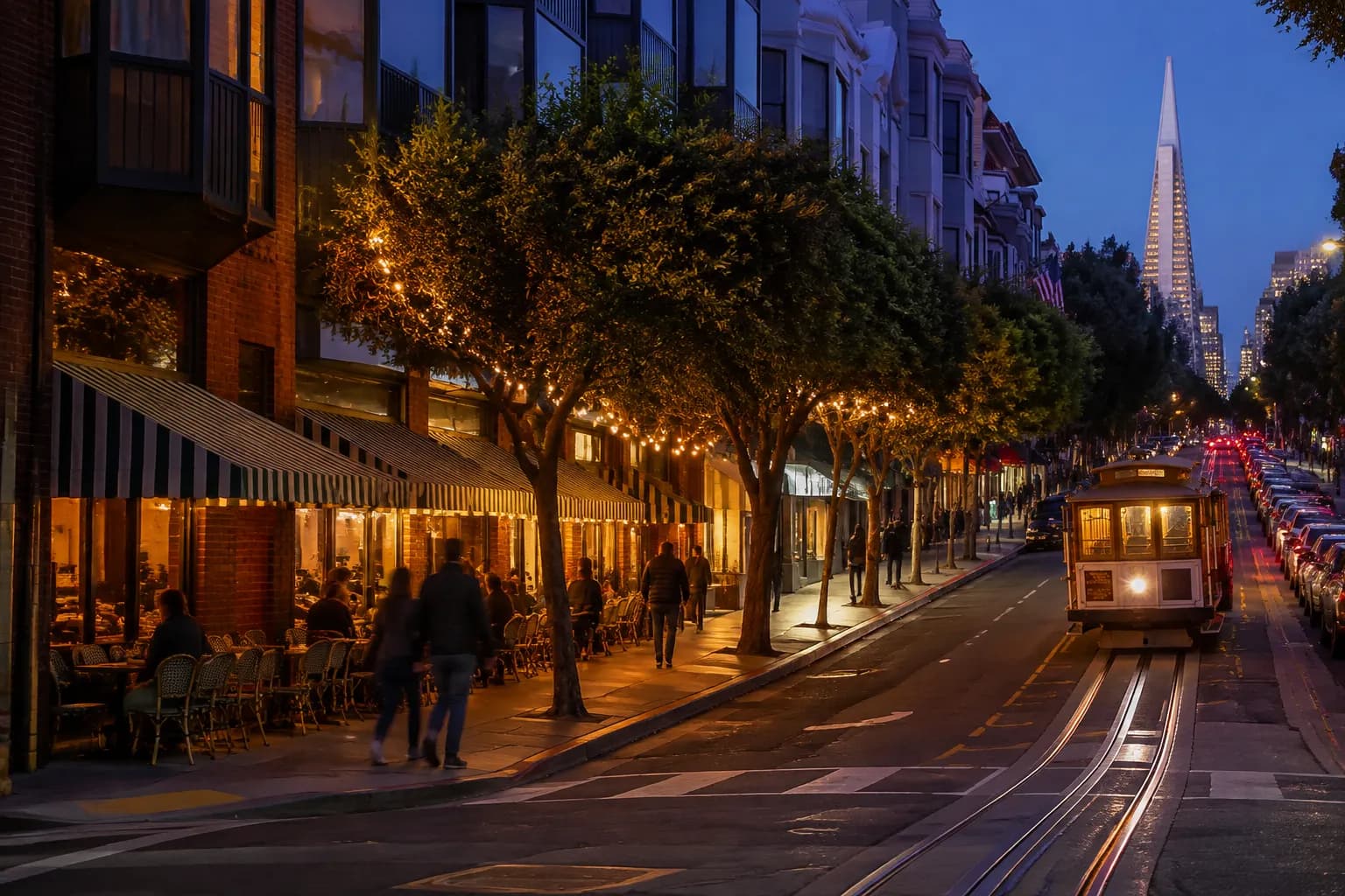 Columbus Avenue in North Beach at dusk with wine bars and cafe seating